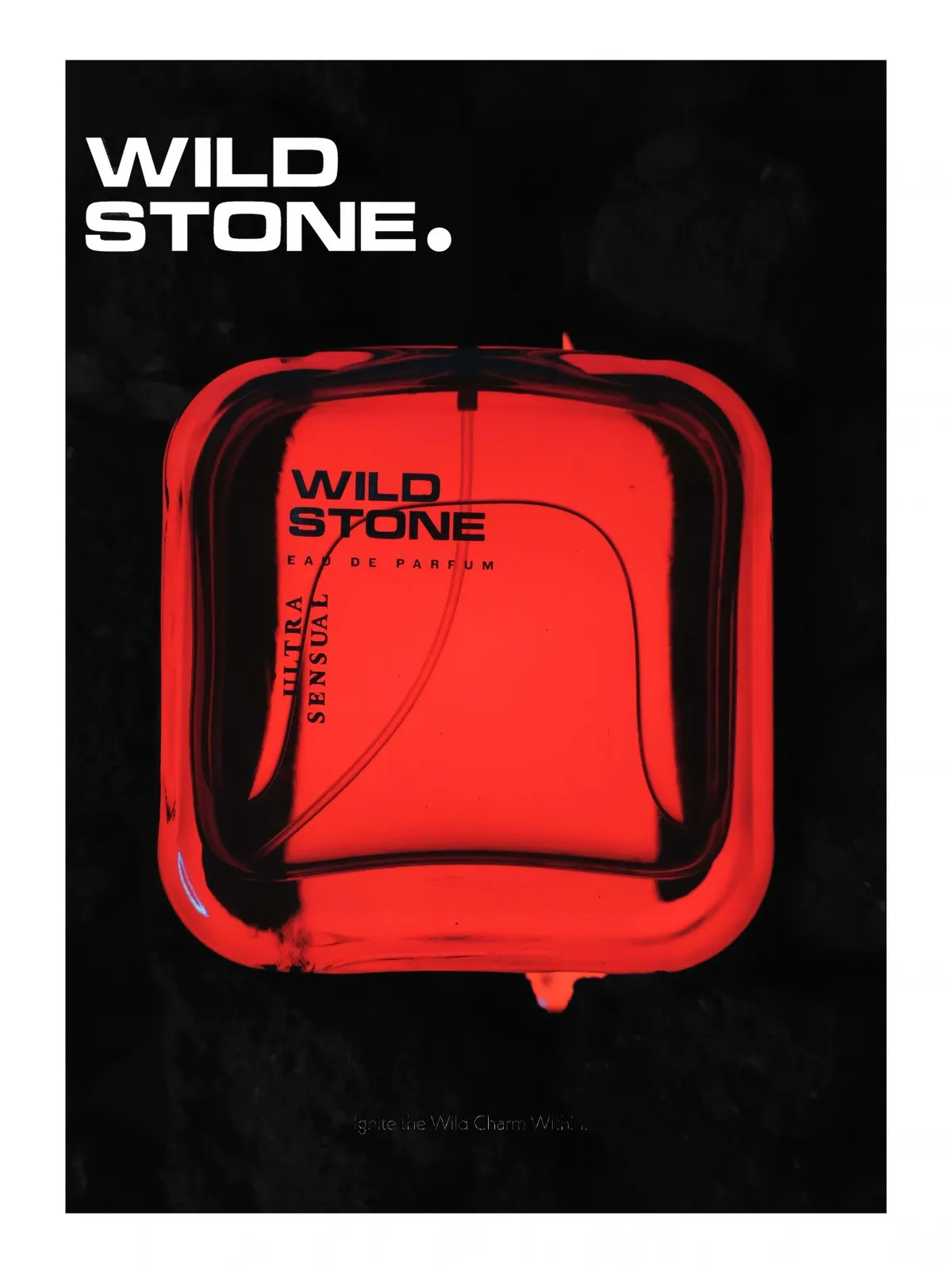 Wild Stone Ultra Sensual bottle glowing red against a black background